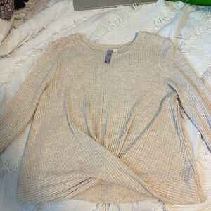 Alya tan sweater. Cross in the front. Size medium.